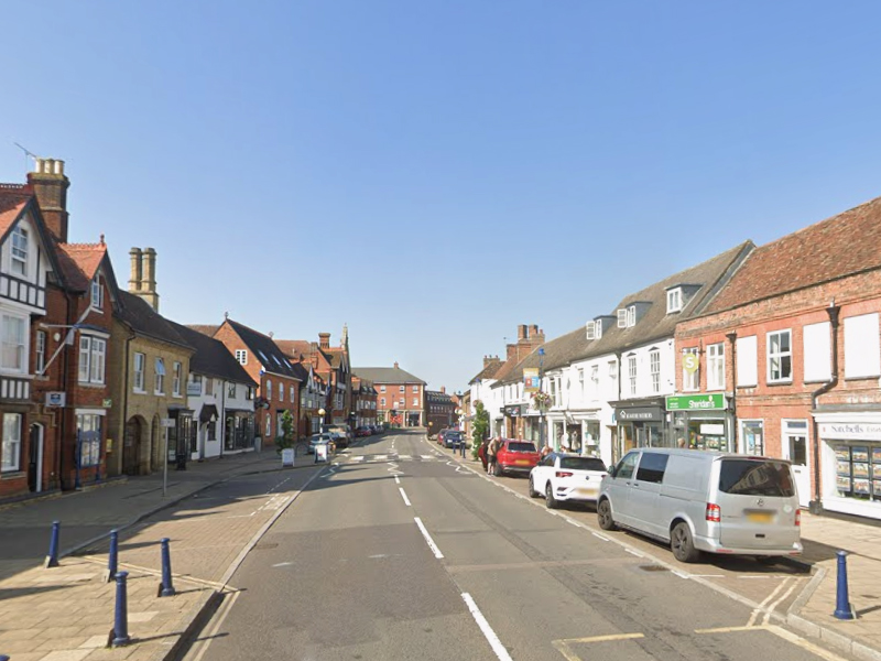 Street view of Shefford town centre, highlighting local mobile collection and delivery services for alloy wheel refurbishment.